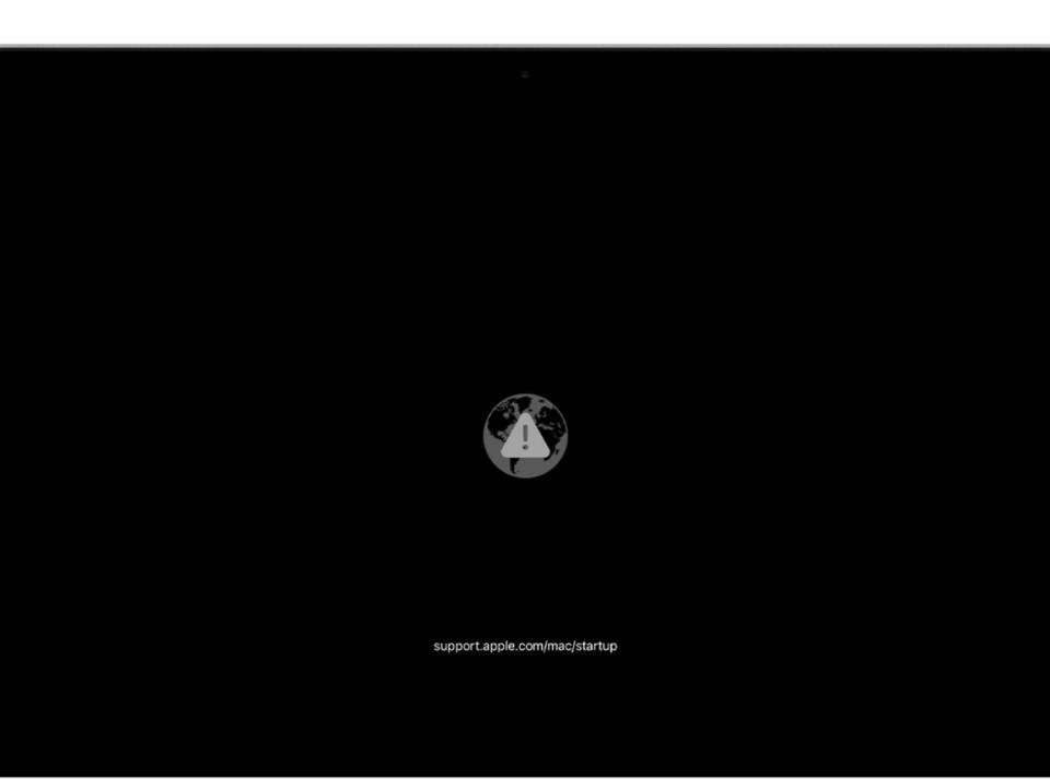 Icono de globo con marca de alerta Mac